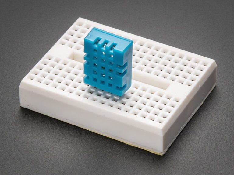 A DHT11 inserted into a small breadboard.